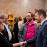 /media/orig/6-A-Noam-Meirov-meets-with-attendees.jpg